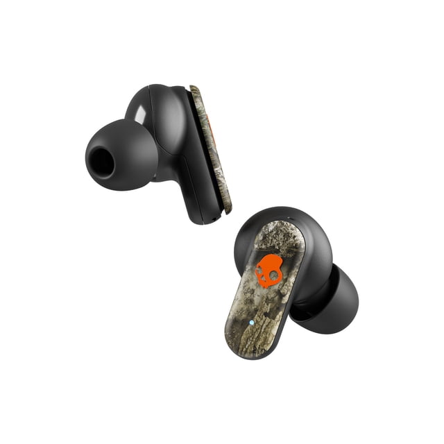 Skullcandy Dime 3 XT wireless earbuds with black silicone ear tips and camo-patterned stems featuring an orange Skullcandy logo, shown in a close-up angled view, offering IPX4 water resistance, Tile finding technology, and up to 20 hours battery life, suitable for active use.