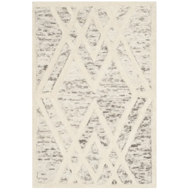 Safavieh Cambridge Rordan Faded Geometric Area Rug featuring hand-tufted wool with a textured high/low pile in a faded diamond geometric pattern in cream and gray, ideal for modern home or office decor and often used as a soft accent rug.