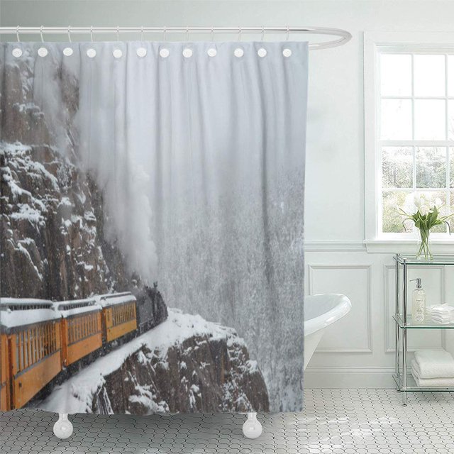 SUTTOM Train The Polar Express Rounds Narrow Gauge Railroad Durango shower curtain, 66x72 inches, made of polyester fabric. Depicts a snowy mountain scene with a yellow train on a narrow gauge railroad. Designed to fit standardized bathtubs, ideal for bathroom decor, with a soft, comfortable feel and water-resistant, environmentally friendly material.