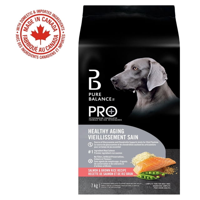 Pure Balance Pro+ Healthy Aging Salmon & Brown Rice Recipe dry dog food bag showing a gray dog side profile on black background, highlighting real salmon as the first ingredient, glucosamine and chondroitin for joint support, no fillers or artificial additives, 7 kg, made in Canada with domestic and imported ingredients.