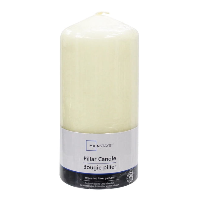 Mainstays Unscented 6 inch ivory pillar candle with smooth wax surface and cotton wick, standing upright with a white and black label showing brand and product details, ideal for ambient lighting, emergency use, and indoor Christmas decorations.