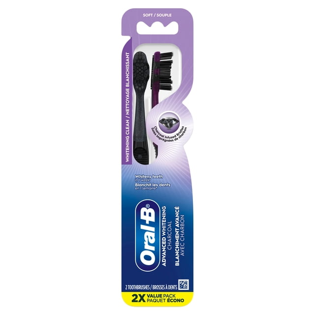 Oral-B Charcoal Toothbrush, Soft, 2-pack with charcoal infused soft bristles for advanced whitening and surface stain removal in one week, featuring multi-level bristles and a tongue and cheek cleaner, purple and black handles in retail packaging.