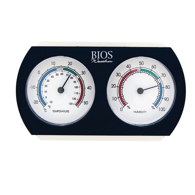 BIOS Analog Thermometer / Hygrometer with two round dials showing indoor temperature in °F and °C on the left and relative humidity percentage on the right, color-coded for easy reading, mounted on a black rectangular frame with BIOS Weather branding, ideal for monitoring home heating, cooling, and air quality.