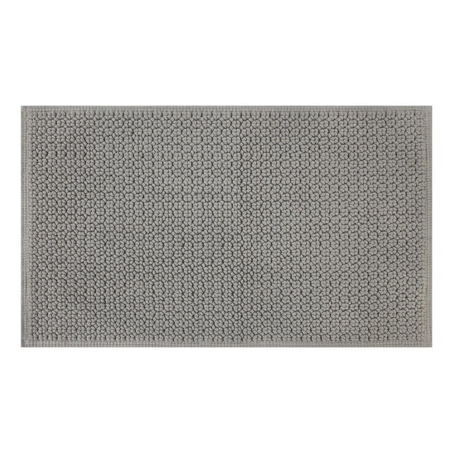 Better Homes & Gardens Signature Soft Looped Bath Mat in soft silver, 20" x 34", made of 100% cotton with a looped texture for absorbency and softness, featuring stitched edges and suitable for bathroom use with a rug pad recommended for wooden floors.