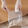 thumbnail image 1 of XYAIYT Portable Mini Bag Sealer and Cutter Handheld Heat Vacuum Sealer for Food Storage Snacks Freshness Resealer Machine Easy to Use No Preheat Required Battery Operated, 1 of 7