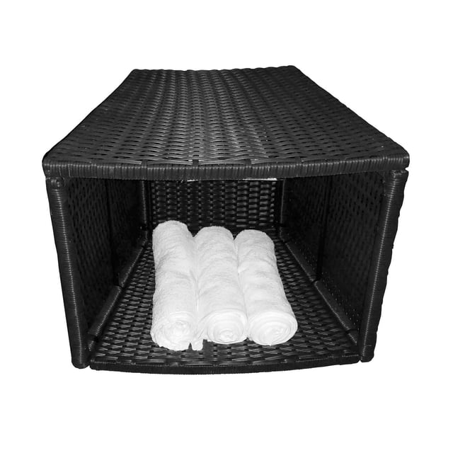 Canadian Spa Surround Furniture Round Side Table in black weather-resistant synthetic rattan featuring a hollow storage space holding three rolled white towels, designed for outdoor hot tub accessory use and also suitable as a bar stool.