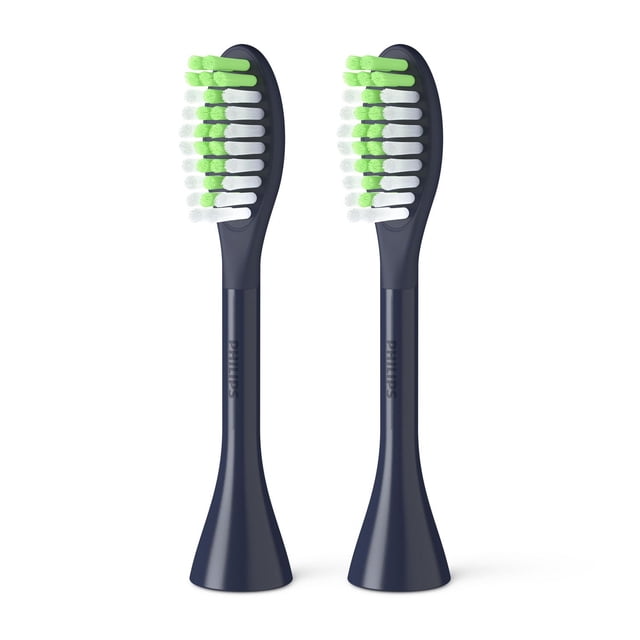 Philips One by Sonicare 2pk Brush Heads in midnight navy with two replacement electric toothbrush heads featuring contoured green and white tapered bristles for gentle polishing and cleaning, compatible with Philips One battery toothbrush handles and ideal for portable oral care.