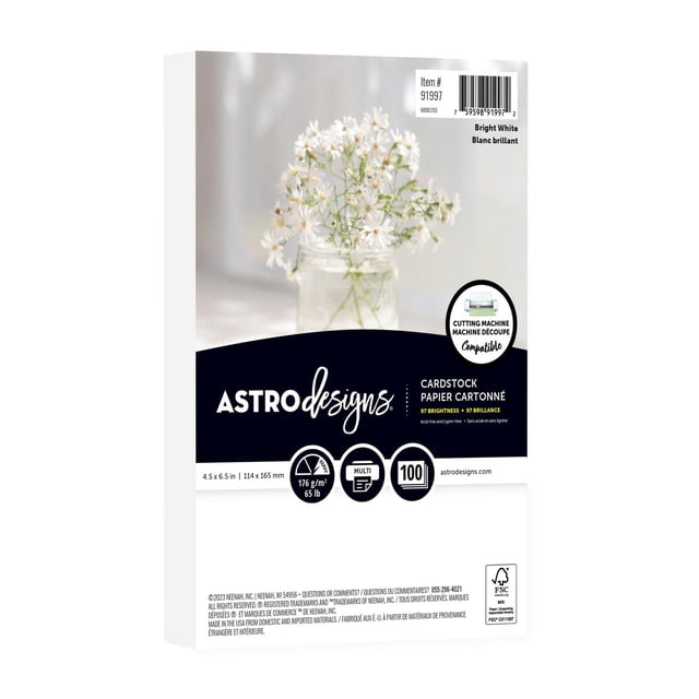 Astrodesigns Bright White Cardstock pack with 100 sheets of 4.5 by 6.5 inch bright white, acid-free, lignin-free cardstock weighing 65 lb, compatible with most cutting machines and printers, shown with a blurred background of white flowers in a glass jar, ideal for crafting, scrapbooking, and card making.