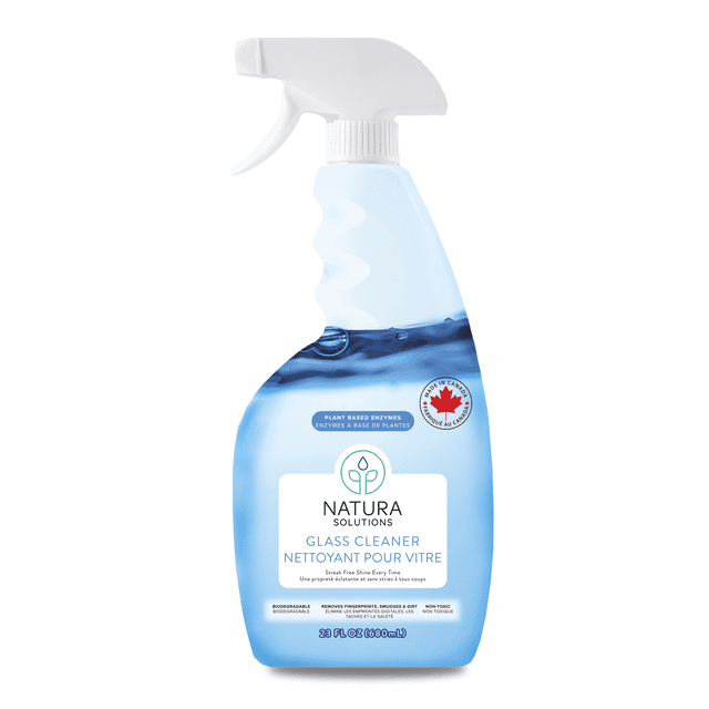 Natura Solutions Glass Cleaner in a 680 ml spray bottle with white trigger and blue liquid, made in Canada. Biodegradable, non-toxic, plant-based enzyme formula delivers streak-free, eco-friendly cleaning for glass, mirrors, and screens.