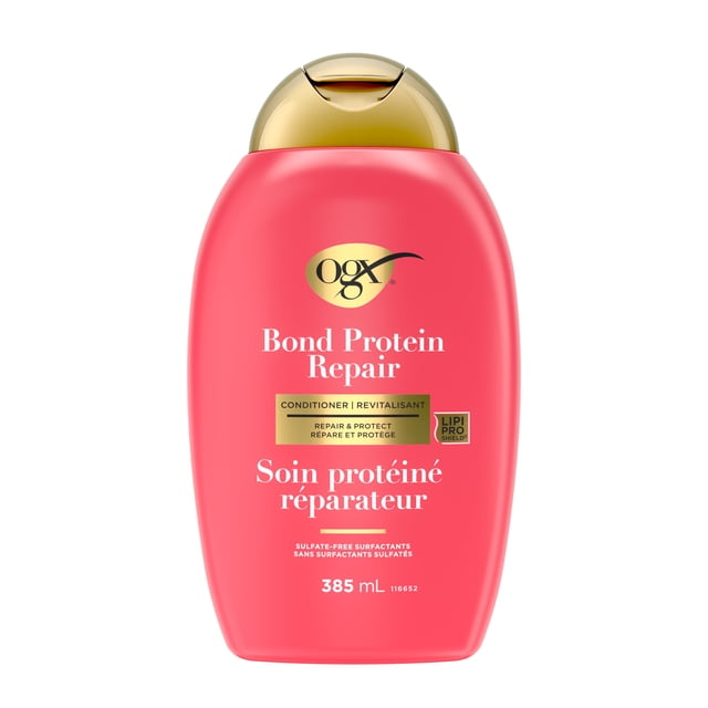 OGX Bond Protein Repair Revitalisant 385 ml en Bouteille Rose Corail avec Bouchon à Clapet Doré, Étiqueté en Anglais et en Français, Doté de la Technologie Lipi Pro Shield pour Réparer et Protéger les Cheveux Secs et Abîmés avec des Tensioactifs Sans Sulfate.