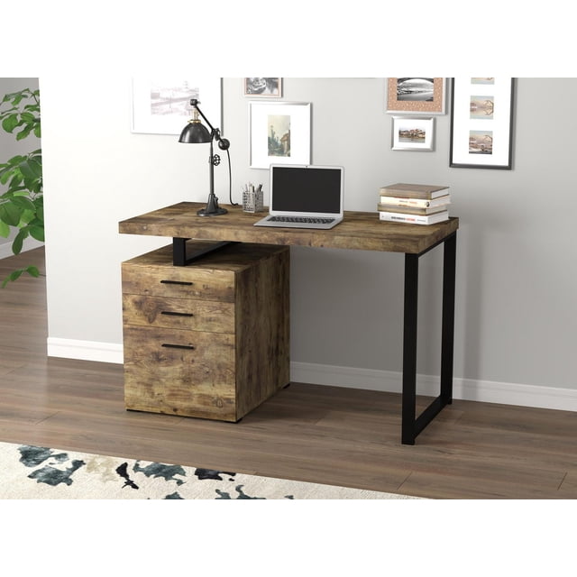 Safdie & Co. Computer Desk 47.25L Brown Reclaimed Wood 3 Drawers Black Metal with a modern office furniture style, featuring a spacious reclaimed wood desktop and sturdy black metal frame. It includes three storage drawers on the left side and is shown with a laptop, adjustable black desk lamp, pencil holder, and stacked books on wood flooring against a light grey wall with framed artwork. The desk is also ideal for organizing office supplies efficiently.