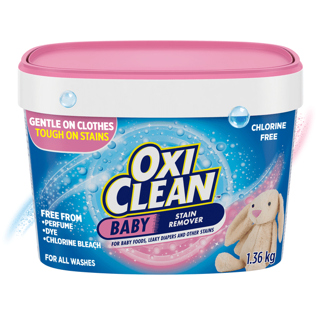 OxiClean Multi-Purpose Baby Stain Remover Powder in a 1.36 kg white and blue plastic tub with a pink lid, a laundry additive gentle on baby clothes and tough on stains, chlorine free, and free from perfume, dye, and chlorine bleach, featuring a plush beige bunny on the label.