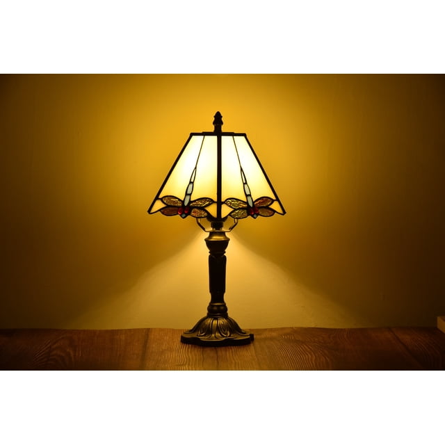 Tiffany Style Table Lamp Dragonfly Desk Lamp Bronze Stained-Glass 14.5'' Height by Orinova. This handcrafted table lamp features a 7.5-inch diameter stained-glass lampshade with a dragonfly design in vibrant multi-colors, paired with a bronze resin base. Measuring 7.5 x 7.5 x 14.6 inches and weighing 4.3 lbs, it is ideal for bedroom nightstands or living room décor. The lamp requires one E26 bulb (not included) and includes a 75-inch cable for convenient placement.