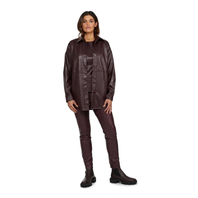 Mexx Faux Leather Women's Shacket in dark brown with fold-over collar, button closure, and adjustable cuffs, worn over matching faux leather pants and paired with black chunky sole boots, designed as a versatile 31-inch length outerwear shirt jacket ideal for transitional seasons.