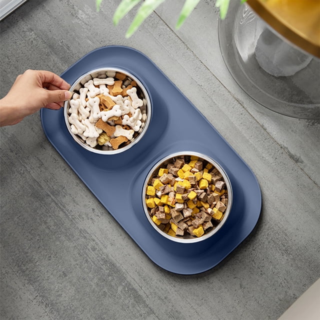Pet Bowl Alls In One Pet Bowl Cats Food Bowl High Foot Cats Bowl Dog Bowl High Foot Feeding Plastic Kitty Bowl Cats Food Bowl Water Bowl High Foot Bowl For Pet. A blue plastic pet bowl with two compartments, each holding food. The bowl features a wide, low-profile design with an ergonomic height to support neck and spine alignment for pets. The smooth, non-porous surface ensures easy cleaning, and the non-slip base provides stability during feeding. Compact and suitable for multi-pet households.