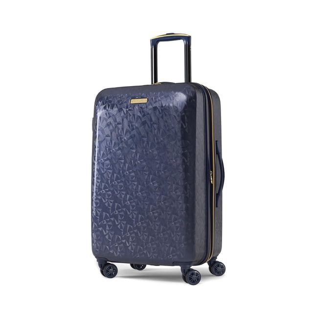 American Tourister Beau Monde HS Medium navy blue hardside checked luggage with geometric textured ABS shell, four dual spinner wheels, multi-stage pull handle, side carry handle, and gold-tone zipper trim, suitable for extended trips and organized packing with removable laundry bag and water-resistant toiletry pouch.