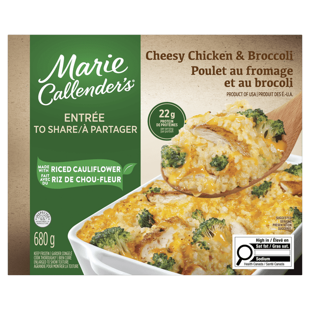 Marie Callender's Cheesy Chicken & Broccoli Frozen Dinner made with riced cauliflower, grilled chicken breast, and broccoli florets in cheese sauce, displayed in a white casserole dish with a wooden spoon lifting a portion, 680 g package with bilingual English and French text, high in saturated fat and sodium, suitable for oven or microwave cooking and ideal for family meals.