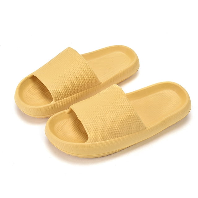 XZNGL Woman Massage Shower Bathroom Open Toe Super Thick Sole Sandals in a soft yellow color, made from textured EVA material for comfort and durability. These super soft massage slippers feature a round toe and flat sole, ideal for indoor and outdoor use, including bathrooms, bedrooms, spas, and pools.