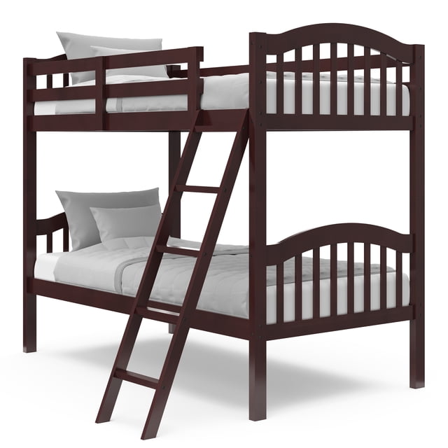 Storkcraft Long Horn Twin over Twin Bunk Bed in dark wood finish featuring a fixed 5-step ladder, full-length safety guardrails on the top bunk, and curved slatted headboards and footboards, shown with white bedding in a front 3/4 view, ideal for kids' rooms and convertible into two twin beds.