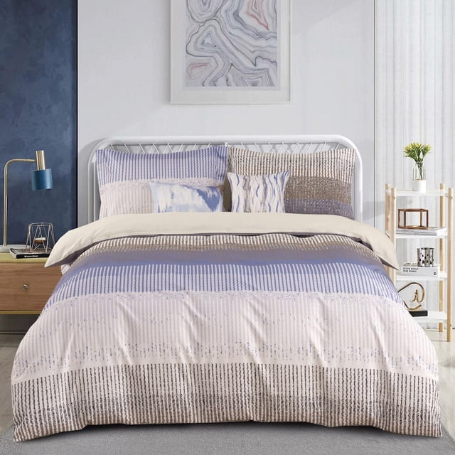 Johnson Home 5-Piece Comforter Set in beige, blue, and brown striped pattern made from 200TC 100% cotton, including comforter, two shams, and two decorative cushions. Designed for all-season comfort with breathable cotton, displayed on a white metal bed frame in a modern bedroom with wooden nightstand and shelving.