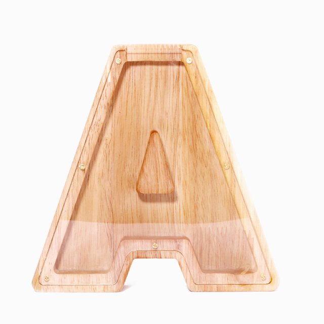 Twenty-Six English Alphabet Piggy Bank in the shape of the letter 'A,' crafted from durable wood with a smooth finish and a transparent acrylic front panel. The design provides a clear view of the savings inside, making it ideal for coins, banknotes, or small decorative items. Includes 26-letter name stickers for customization.