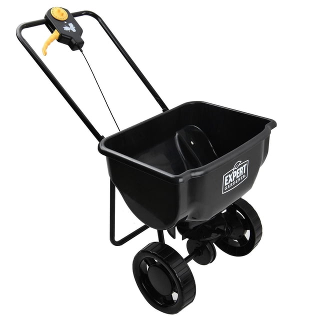Expert Gardener 15000SQ ft Push Spreader with black plastic hopper and steel frame, featuring a U-style handle with orange control dial and trigger, two black wheels, designed for precise spreading of fertilizer, seed, salt, or ice melt over large lawn areas.