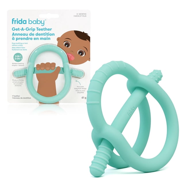 Frida Baby Get-A-Grip BabyTeether in teal, made from 100% food-grade silicone with a wearable wrist-hugging design and crossbar handle featuring multiple textured shapes to soothe sore gums, shown with packaging depicting a baby holding the teether, suitable for infants 0-18 months.