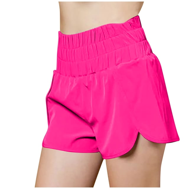 Timegard Workout Shorts for Women in a vibrant pink color, featuring a high-waisted smocked elastic waistband and lightweight, quick-dry fabric. Designed for athletic activities like gym workouts, running, and basketball, these shorts offer a loose fit with a flattering silhouette and curved hem. Made from 95% polyester and 5% spandex for breathability and comfort.