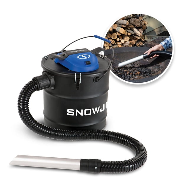 Snow Joe ASHJ201 Ash Vacuum, 4.8-gallon black metal canister with blue motor housing, flexible black hose with aluminum intake nozzle, designed for dust-free ash removal from wood stoves, fireplaces, and firepits, shown cleaning cold ashes from a firepit with stacked firewood nearby.