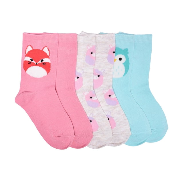 Squishmallows 3 pack Crew Socks for girls size 10-13, made of 97% polyester and 3% spandex. Includes pink socks with a red fox face, beige socks with pink and purple llama patterns, and light blue socks with a teal owl face. Machine washable and suitable for everyday wear.