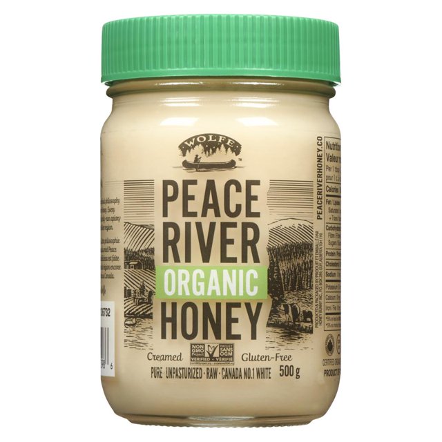 CREAMED ORGANIC HONEY in a 500g jar with a green screw-on lid, labeled Peace River Organic Honey, certified non-GMO and gluten-free, made from pure, raw, unpasteurized honey from Canada’s Peace River region, suitable for natural sweetening and culinary uses.
