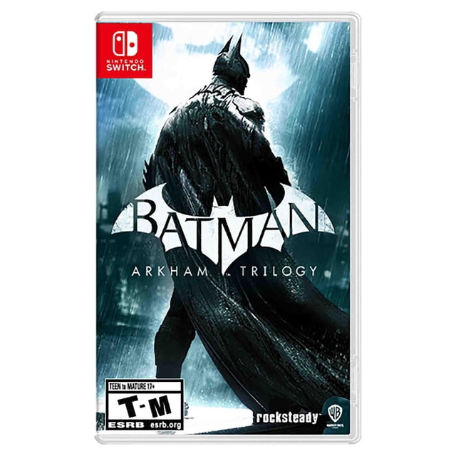 Batman: Arkham Trilogy Nintendo Switch game cover Montrant Batman Debout sous la Pluie avec cape Fluide, avec le logo et le Titre Batman, Homologué T-M, Développé par Rocksteady et Publié par Warner Bros, Convient aux Joueurs d'Action et d'Aventure.