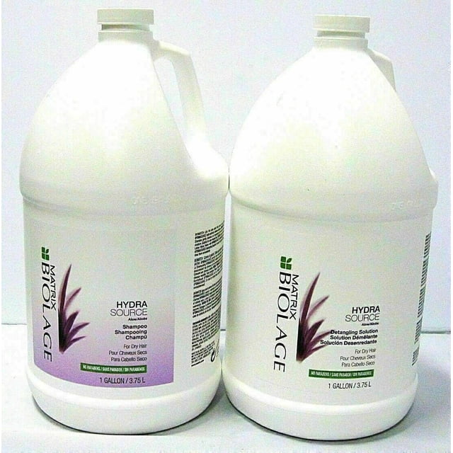 Matrix Biolage HydraSource Shampoo & Detangler Gallon Size DUO, a hair care set with two 1-gallon bottles. The shampoo bottle features a purple label, and the detangler bottle has a green label. Both are paraben-free and formulated for dry hair.
