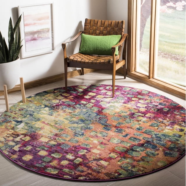 Safavieh Monaco Driskoll Abstract Area Rug, a round polypropylene accent rug with a vibrant abstract pattern in purple, orange, green, and blue tones, placed on a tiled floor beside a woven leather chair with a green cushion near a sunlit window and a potted snake plant, ideal for adding Bohemian-chic flair to home interiors.