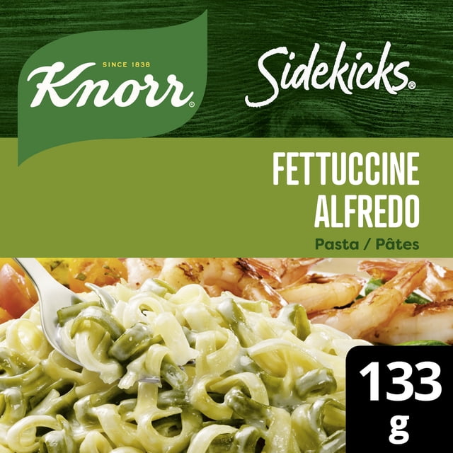 Knorr Sidekicks Fettuccine Alfredo Pasta Side Dish with creamy Parmesan and Romano cheese sauce coating golden and spinach rippled fettuccine pasta, shown with shrimp and a 133g package size, suitable for quick, easy meals.