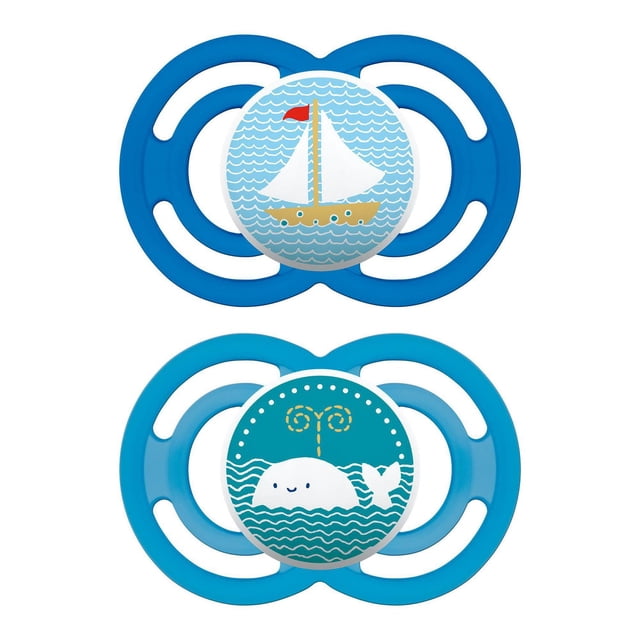 MAM Perfect Pacifiers, Orthodontic Pacifiers (2 pack) for babies 6+ months, featuring two blue pacifiers with symmetrical shields; one has a sailboat on light blue waves, the other a smiling whale spouting water on teal waves, both with SkinSoft silicone nipples designed to reduce jaw pressure for breastfed babies.