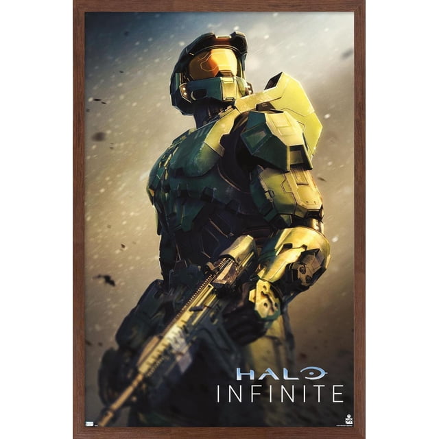 Halo Infinite - Become Wall Poster, 22.375" x 34" framed showing Master Chief in green and gold armor holding an assault rifle against a blurred dusty background with the Halo Infinite logo, suitable for gaming room or home décor.
