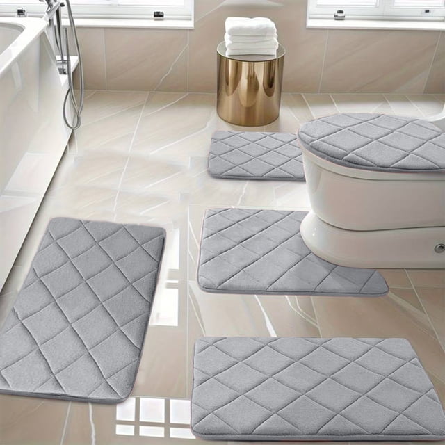 Ycandiee Bathroom Rug Set 5 Piece in grey, featuring soft non-slip memory foam bath mats. Includes a toilet lid cover, U-shaped counter rug, small bathroom rug, and two large bath rugs. Designed for water absorption and comfort, with a quilted texture and PVC non-slip backing. Suitable for use by the tub, sink, or vanity. Displayed in a modern bathroom setting with tiled floors and natural light.