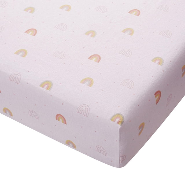 George Baby Organic Flannel Crib Sheet in soft pink with small pastel rainbow patterns, made from 100% organic cotton flannel, fitted to a crib mattress corner, gentle for sensitive baby skin and suitable for everyday use.
