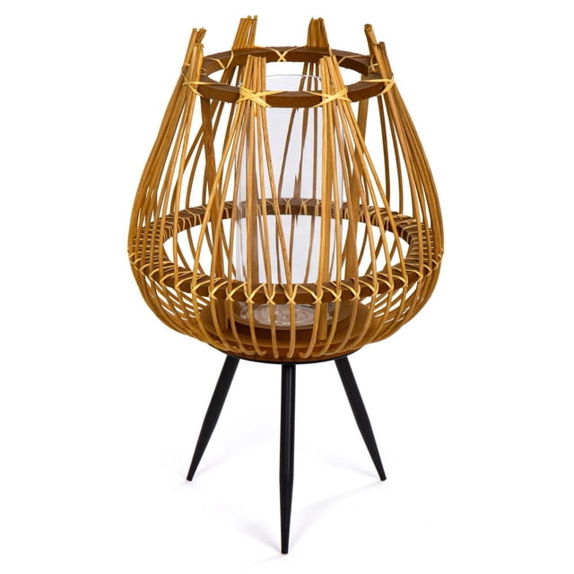 Truu Design Decorative Bamboo Floor Candle Holder with Legs, featuring a beige bamboo and MDF droplet-shaped frame with vertical slats tied with natural fiber, enclosing a clear glass candle cup, supported by three black metal legs, suitable for creating cozy indoor or outdoor ambience.