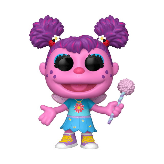 Funko Pop! Télévision : Sesame Street - Abby Cadabby Figurine en Vinyle Montrant une Figurine en Vinyle Rose Orientée vers l'Avant avec des Queues de Cochon Violettes Attachées avec des Accessoires de Coccinelle et de Fleur, Portant une Robe à Motif de Fleurs Bleues et des Espadrilles Jaunes, Tenant une Baguette à Pompon Rose. Cette Figurine de Collection Mesure Plus de Trois Pouces de Hauteur et Convient pour l'Exposition Ou comme Jouet à Tête Oscillante.