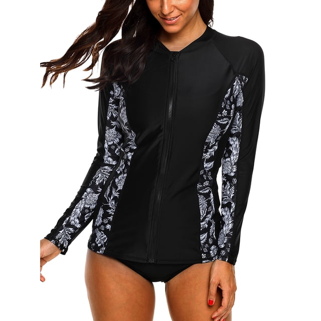 Charmo Haut anti-UV à Fermeture Éclair devant pour Femmes à Manches Longues Rashguard, Chandail de Bain de Protection Solaire Noir avec Panneaux Imprimés Floraux sur les Manches et les Côtés. Conçu avec une Fermeture Éclair avant pour un Enfilage Facile, Protection Solaire UPF 50+, et Tissu Extensible à Séchage Rapide. Parfait pour les Vêtements de sports Nautiques pour Femmes, Y Compris la Natation, le Surf, la Plongée en Apnée et le yoga.