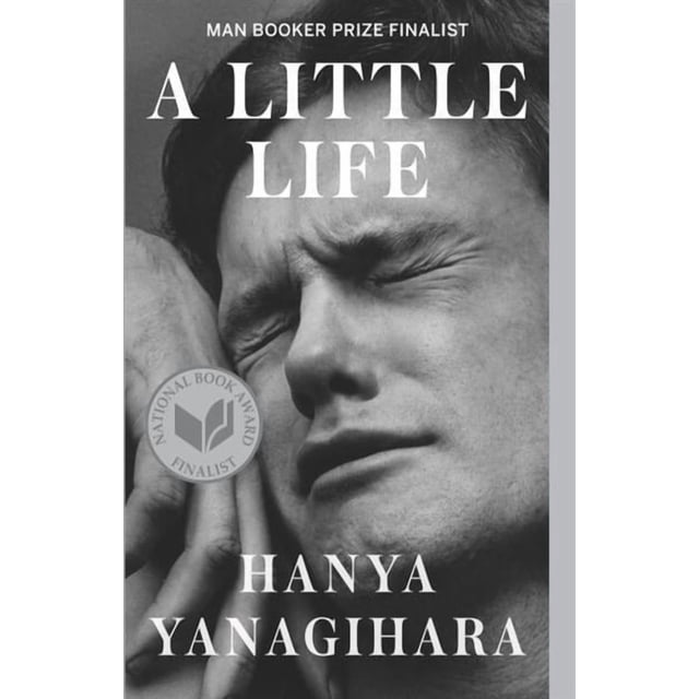 A Little Life front-facing book cover with the title 'A Little Life' in centered serif type on a muted background; close crop shows the spine edge and page block on a flat studio surface, often used as a literary fiction bedside read or gift.