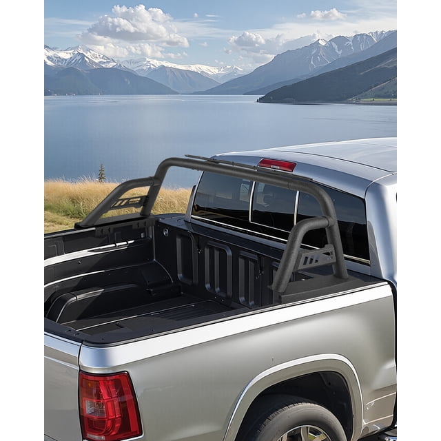 VEVOR Truck Bed Roll Bar Universal Chase Rack for full-size pickup trucks, made of durable carbon steel with a matte anti-rust coating. The roll bar is installed on the bed of a silver pickup truck, featuring adjustable side mounting plates for compatibility with various truck bed sizes. It includes a light mounting bracket for enhanced visibility during night driving and is designed to prevent obstruction of the third brake light. The truck is parked in a scenic outdoor setting with a lake and mountains in the background.