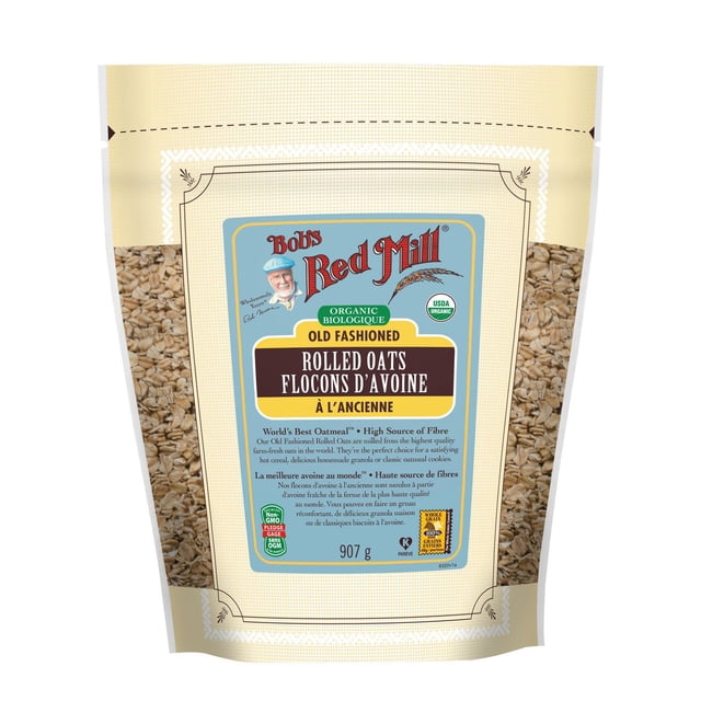 Bob's Red Mill Flocons d'Avoine à l'Ancienne Biologiques 907 g beige Sac Refermable avec Panneaux Latéraux Transparents Montrant des Flocons d'Avoine Entiers, avec une Étiquette Bleue avec Texte Rouge et Jaune Mettant en Valeur des Flocons d'Avoine Biologiques à l'Ancienne, Biologique USDA et Certifié non-OGM, Idéal pour l'Avoine, granola et Pâtisserie.