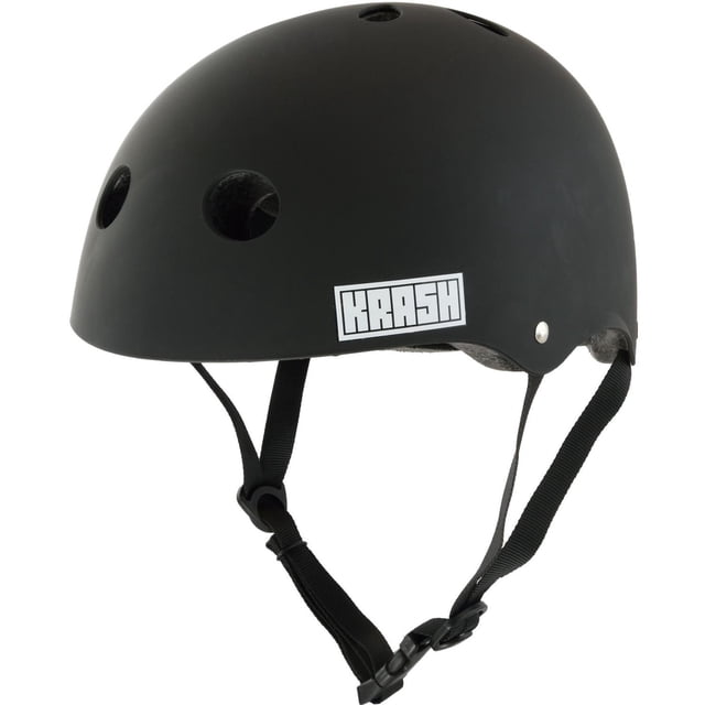 Bell Sports Krash! Bluetooth® Speaker Youth Helmet Black shown in a 3/4 profile with a matte black finish, ventilation holes, and adjustable black chin strap. It includes an integrated wireless speaker at the rear for up to 3 hours of clear audio, fits head sizes 54-58cm, and is suitable for cycling and multi-sport use.