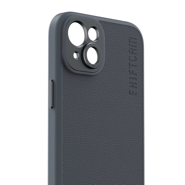 Shiftcam Camera Case for iPhone 15 Plus in dark grey vegan leather with textured finish, featuring a built-in black aluminum lens mount for precise camera alignment and embossed Shiftcam logo, shown in a close-up angled view highlighting camera cutouts and side button.