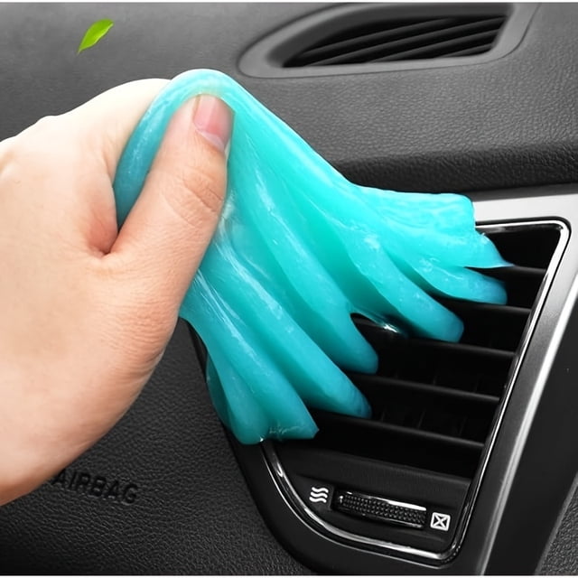 EASTIN Universal Gel Cleaner for car cleaning, shown in use as a hand applies the blue gel to clean dust from a car's air vent. Ideal for interior cleaning and dust removal in automotive maintenance.