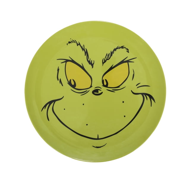 The Grinch Grande Assiette en Mélamine de 10 Pouces avec un Fond Vert vibrant et le Visage du Tristement Célèbre Grinch, Y Compris Ses Yeux Jaunes Perçants et Son Sourire Espiègle. Fabriquée en Mélamine durable, Cette Assiette de 10 Pouces Est sous Licence Officielle et Parfaite pour les Tables à Thème des Fêtes. Va au Lave-Vaisselle, Mais Ne Passe Pas au Micro-Ondes.