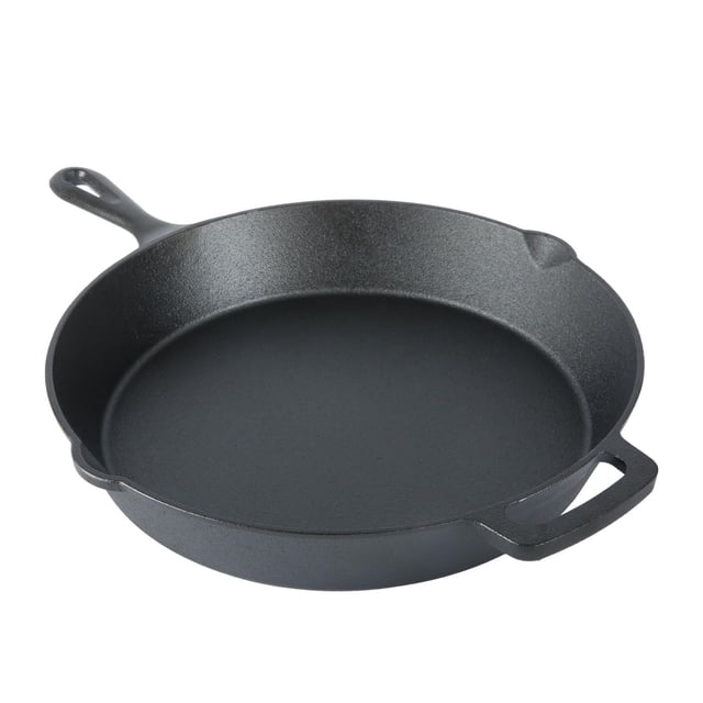 Mainstays 12-inch cast iron skillet with matte black finish, featuring a long handle with hang-hole, helper handle for lifting, and side pour lip for draining, designed for even heating and hand wash only, suitable for home or outdoor cooking.